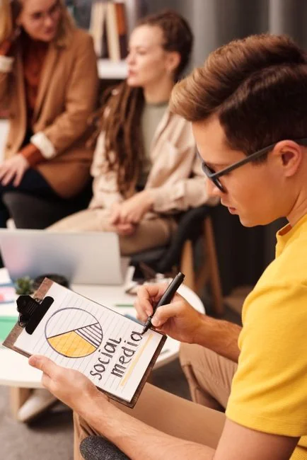 Close-up of SEO strategy planner with colorful sticky notes and a pencil on a notebook.